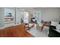Open concept living room with stylish decor, hardwood floors, and ample natural light at 2023 Oakview Se Rd # 226, Atlanta, GA 30317