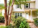 Charming two-story home featuring manicured greenery and a welcoming front porch at 3150 Stratford Green Pl, Avondale Estates, GA 30002