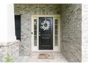 Close-up of the front door, featuring a welcoming wreath at 3302 Bellingham Way, Lithia Springs, GA 30122