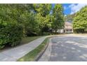 View of the home from the street showing the sidewalk and streetscape at 3698 Lakeview Drive, Tucker, GA 30084
