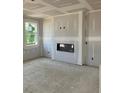 Bright living room with contemporary fireplace, offering a cozy and inviting space at 7226 Lacey Dr Lot 125, Douglasville, GA 30134
