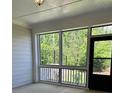 Relaxing screened porch offering beautiful views of the lush backyard and privacy at 3708 Cheswolde Ave # 95, Powder Springs, GA 30127