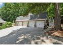 Spacious detached three-car garage with a long driveway and ample parking at 3978 Devonshire Dr, Marietta, GA 30066