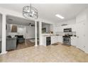 Open-concept living and kitchen area with updated appliances at 2964 Greyhawk Ln, Cumming, GA 30040