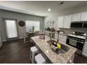 Kitchen with granite countertops, stainless steel appliances and an island with bar stool seating at 370 Winston Cir, Canton, GA 30114