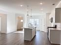Modern kitchen with an island, stainless steel appliances, and an open floor plan at 3865 Shelleydale Dr # 82, Powder Springs, GA 30127
