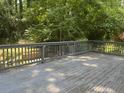 Spacious wooden deck with railing, ideal for outdoor entertaining in a private backyard setting at 1413 David Cir, Decatur, GA 30032