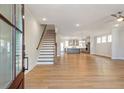 Bright and airy living room featuring hardwood floors and an open floor plan at 148 Palm St, Holly Springs, GA 30115
