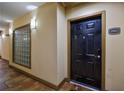 Inviting hallway entrance featuring stylish lighting, a secured front door and a sidelight with decorative glass bricks at 390 17Th Nw St # 2053, Atlanta, GA 30363