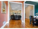 Open floor plan with hardwood floors showcases a living room and dining area with abundant natural light at 40 Costleys Bridge Dr, Oxford, GA 30054