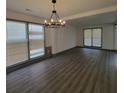 Spacious living room features wood flooring and neutral paint at 3045 Binghampton Ln, Lawrenceville, GA 30044