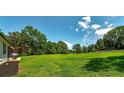 Expansive backyard featuring green lawn and natural wooded backdrop at 858 Pates Creek Rd, Stockbridge, GA 30281