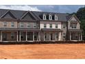 New townhomes with brick exteriors, covered entrances, and dark roofing at 3232 Cyrus Creek Dr, Kennesaw, GA 30152