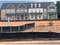 Modern three-story townhomes with brick exteriors, gray accents, and ample natural light at 3232 Cyrus Creek Dr, Kennesaw, GA 30152