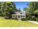 Beautiful exterior showcasing a well-manicured lawn and inviting front facade at 6280 Autry Mill Rd, Cumming, GA 30028