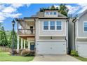 Inviting two-story home with a covered balcony and attached two-car garage at 1858 Belmore Se St, Smyrna, GA 30080