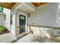 Covered entryway with brick accents leading to a stylish front door at 1858 Belmore Se St, Smyrna, GA 30080
