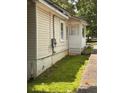 Side view showing the home's vinyl siding and access to the backyard at 519 Roy Sw St, Atlanta, GA 30310