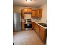 Efficient kitchen layout with stainless steel appliances and neutral countertops at 519 Roy Sw St, Atlanta, GA 30310