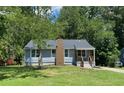 Charming single-story home with a well-manicured lawn and inviting curb appeal at 2039 Gober Ave Se, Smyrna, GA 30080