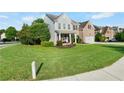 Beautifully landscaped front yard with a well-maintained lawn surrounding a classic two-story home with attached garage at 109 Hale View Cir, Canton, GA 30114