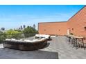 Spacious rooftop deck with city views, featuring ample seating for entertaining or relaxing outdoors at 525 Parkway Ne Dr # 306, Atlanta, GA 30308