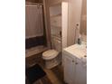 This bathroom has a white sink, vanity, shower and toilet at 3363 Lake Valley Nw Rd, Atlanta, GA 30331