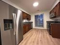 Kitchen featuring stainless steel appliances, wood cabinets, and granite countertops at 1271 Whitlock Ridge Sw Dr, Marietta, GA 30064