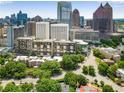 Stunning aerial view of a high-rise apartment building with the cityscape in the background at 145 15Th Ne St # 1430, Atlanta, GA 30309