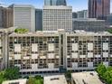 View of apartment building showing symmetrical design and urban surroundings at 145 15Th Ne St # 1430, Atlanta, GA 30309