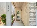 Welcoming front entryway with a decorative glass door and manicured landscaping at 305 Hidden Creek Ln, Canton, GA 30114