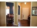 Open foyer leading to dining room, featuring hardwood floors and a welcoming atmosphere at 405 Mallory Cir, Loganville, GA 30052