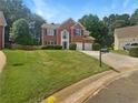 Charming two-story brick home with a lush front lawn and inviting curb appeal at 4133 Rosedown Nw Ct, Kennesaw, GA 30144