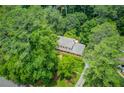 Aerial view of a beautiful home nestled in a serene, wooded setting, showcasing its privacy at 2291 Smokehouse Path, Lawrenceville, GA 30044