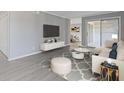 Comfortable living room with sliding glass door and neutral decor at 3236 Henderson Mill Rd # 5, Atlanta, GA 30341