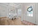 Bright dining room features a coffered ceiling, elegant chandelier, and stylish decor at 432 Providence Walk St, Canton, GA 30114