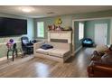 Cozy living room with hardwood floors, fireplace, and comfortable seating at 2433 Robin Ridge Dr, Dacula, GA 30019
