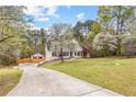 Beautiful home with lush trees and long driveway at 195 Blackberry Run, Fayetteville, GA 30214