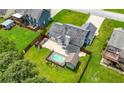 A spacious backyard with a pool and patio provides an ideal space for entertaining at 314 Spring Falls Drive, Lawrenceville, GA 30045