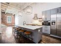 Stylish kitchen with a large island, stainless steel appliances, and gray cabinets at 320 Martin Luther King Jr Se Dr # 9, Atlanta, GA 30312