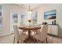 Cozy staged dining room with a round table, four chairs, and plenty of natural light at 252 Stone Park Dr, Woodstock, GA 30188