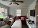 Cozy living room featuring natural light, comfortable seating, and ceiling fan at 2620 Northview Ave, Decatur, GA 30032