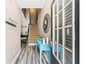 Inviting foyer featuring stylish wood flooring and a staircase at 146 Sunset Ln, Woodstock, GA 30189