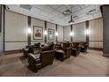 Cozy theater room equipped with plush chairs, projector, and screen to enjoy movie nights at home at 3040 Peachtree Nw Rd # 1713, Atlanta, GA 30305