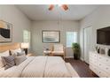 Comfortable bedroom with neutral walls, hardwood floors, and a ceiling fan at 5341 Terrytown Ln, Lithonia, GA 30038