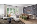 Contemporary living room showcasing unique wall art, comfortable seating, and plenty of natural light at 1480 Wicker Wood Se Pl # 21, Smyrna, GA 30080