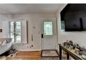 Bright entryway featuring a decorative glass door, hardwood floors, and charming accents for a welcoming ambiance at 3229 Richwood Dr, Duluth, GA 30096