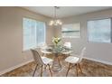Bright dining area with a modern table set, large windows and stylish light fixture at 6200 Beaver Creek Trl, Atlanta, GA 30349