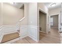 Bright townhome foyer with staircase, closet and wood flooring at 213 Riverstone Commons Cir, Canton, GA 30114