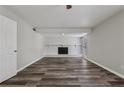 Open living room featuring a white fireplace and sleek, modern flooring at 2849 Snapfinger Rd, Decatur, GA 30034